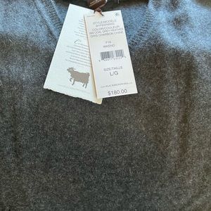100% cashmere sweater. Grey bran new with tags.